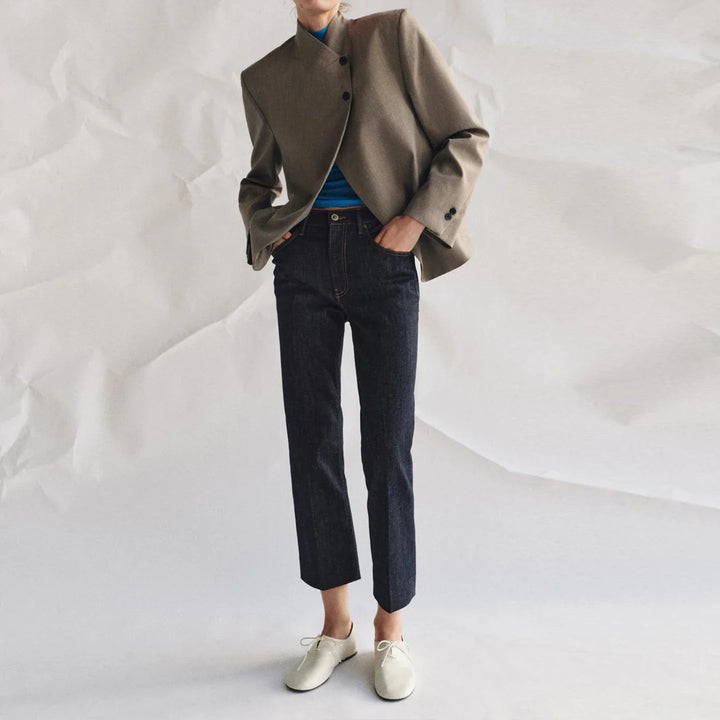 Women's collarless button blazer with long sleeves and front pockets