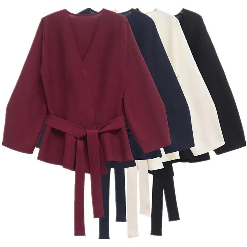 Women's wrap knit top with V-neckline, long sleeves and front tie waist