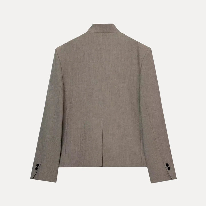 Women's collarless button blazer with long sleeves and front pockets