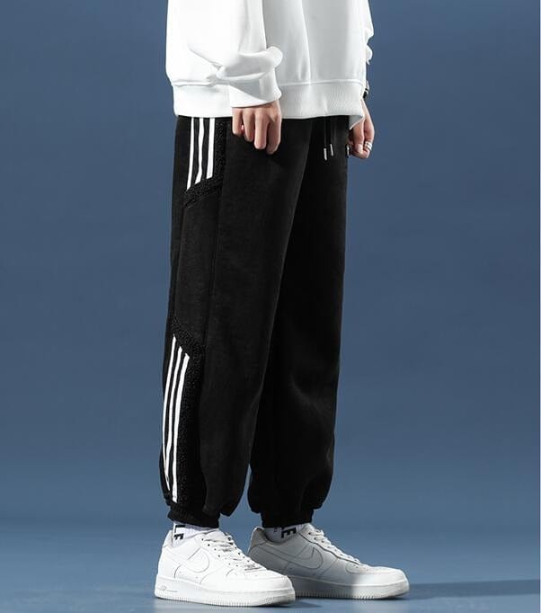 Fleece jogger pants with striped side panels and ribbed cuffs