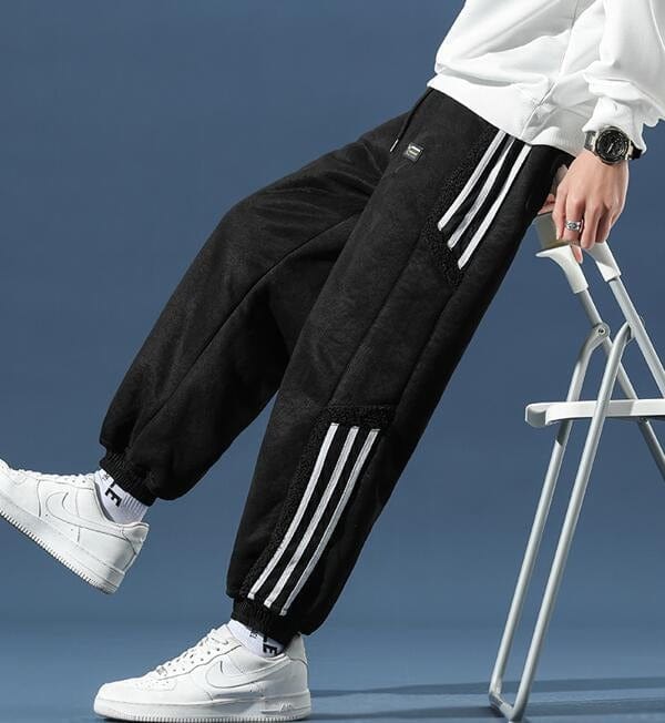 Fleece jogger pants with striped side panels and ribbed cuffs