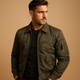 Men's green bomber jacket with zip fastening, multiple pockets and ribbed trims