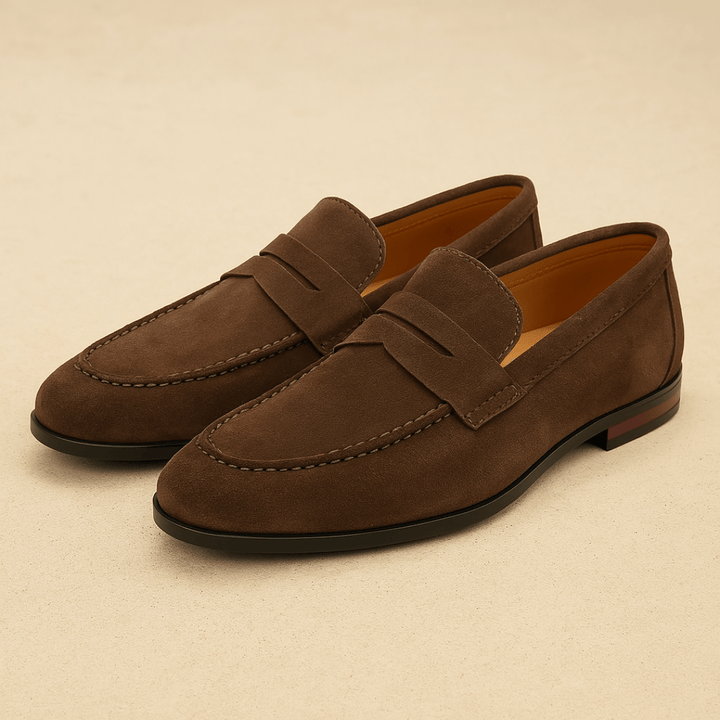 Men's penny loafers with moc toe stitching and low heel