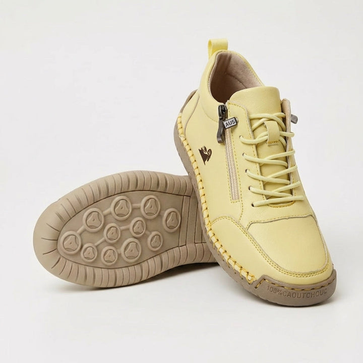Women's lace-up trainers with side zip and flat textured sole