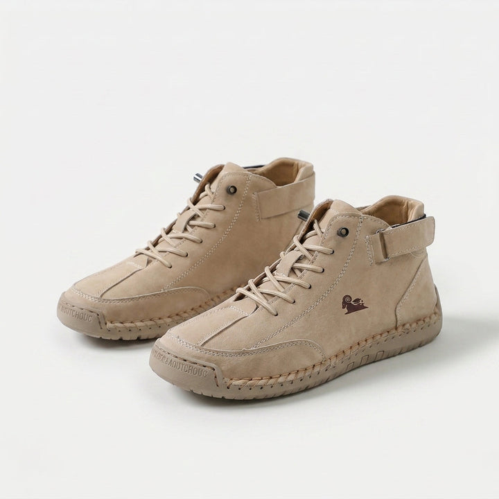 High-top lace-up sneakers with ankle straps, round toes and stitched panel detailing