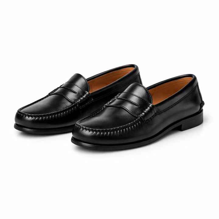 Women's slip-on loafers with moc toes, penny strap detail and low heels