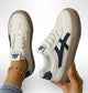 Low-top lace-up sneakers with contrasting side stripes and textured soles