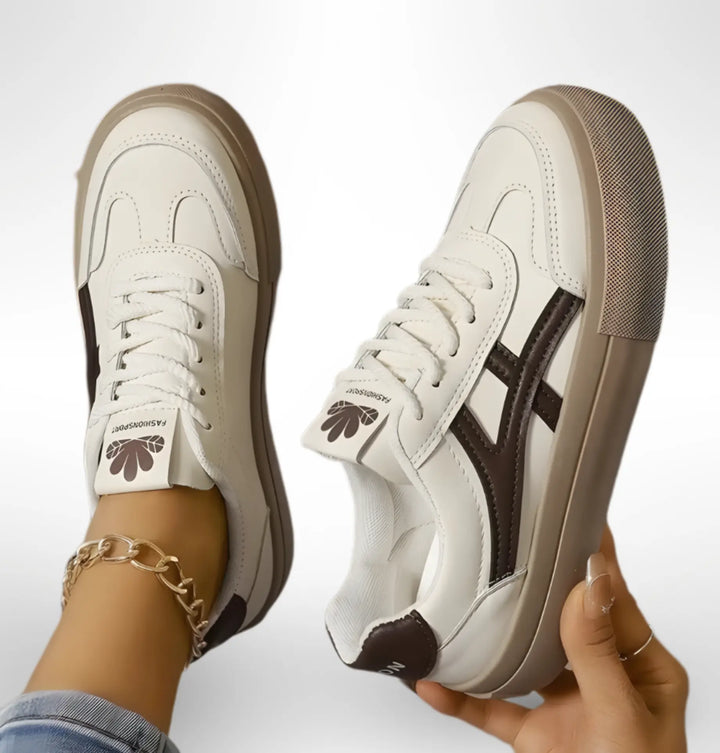 Low-top lace-up sneakers with contrasting side stripes and textured soles