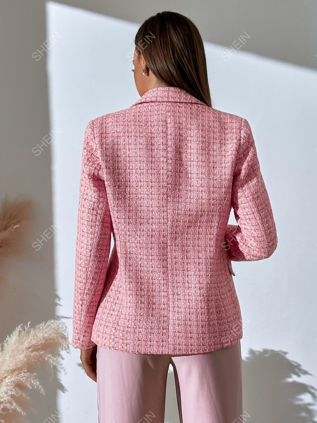 Women's checked tweed blazer with notched lapels and flap pockets