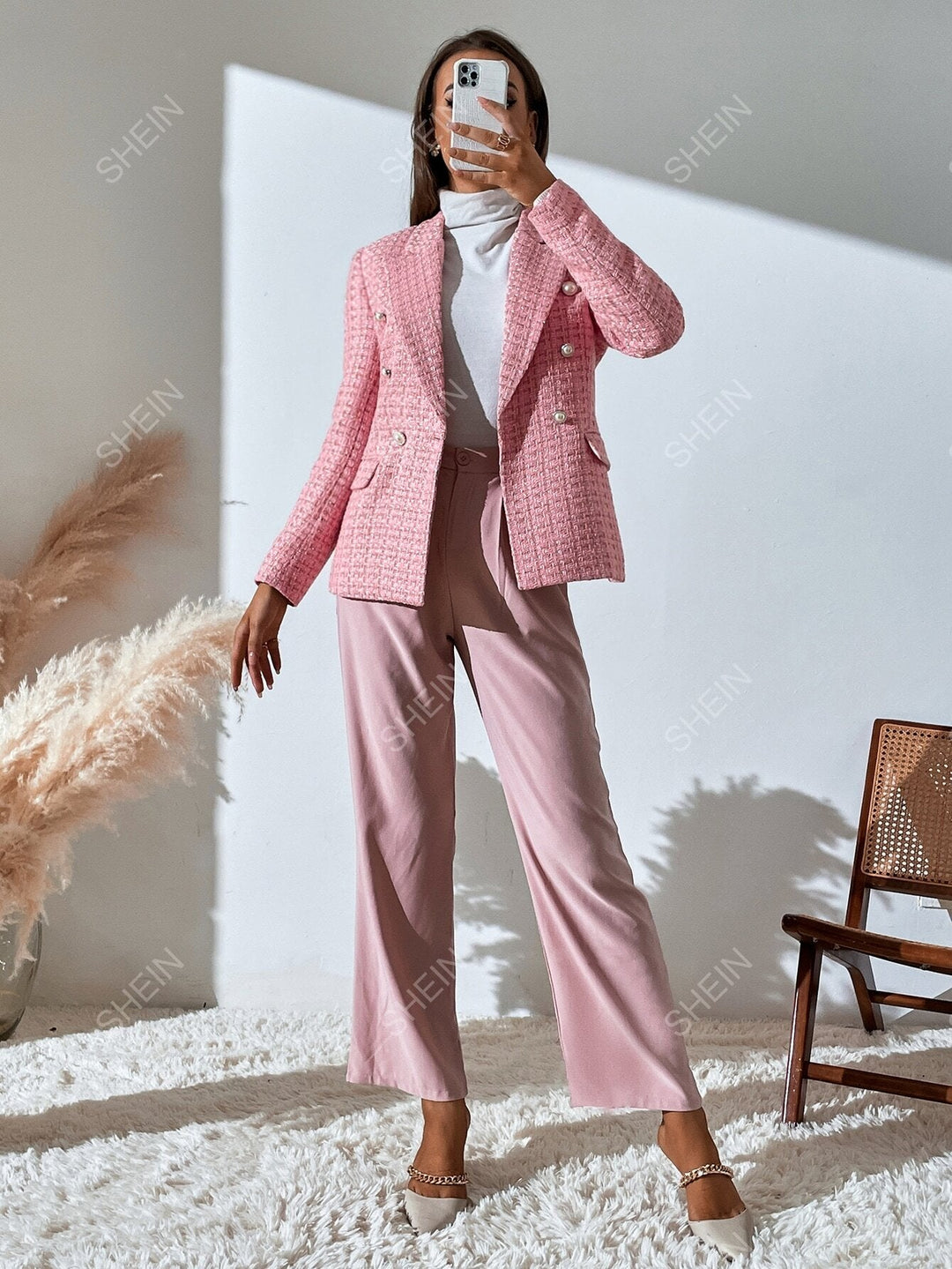 Women's checked tweed blazer with notched lapels and flap pockets