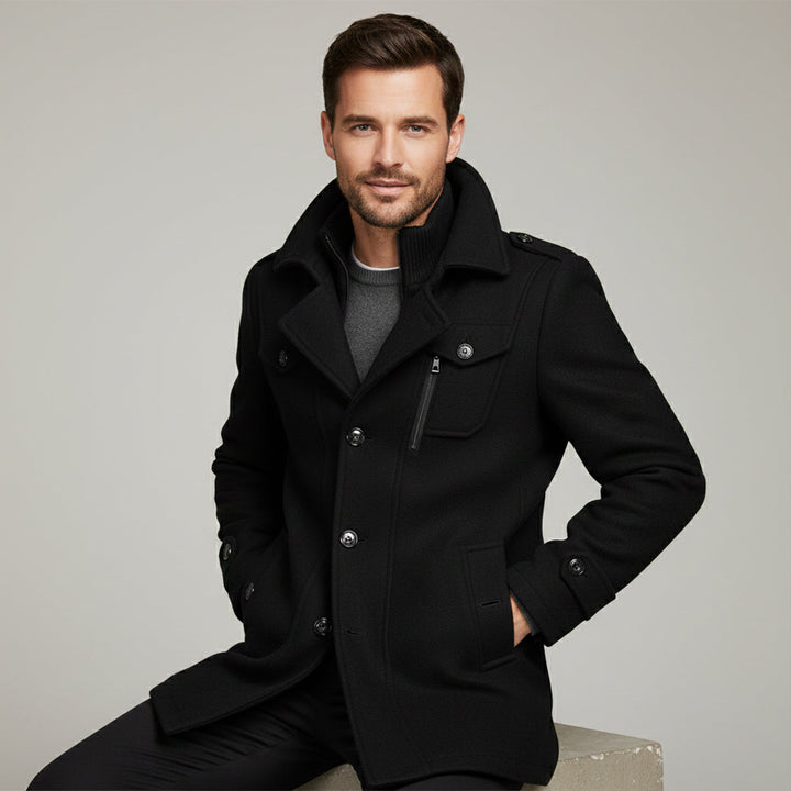 Men's long structured coat with high collar, zip front, buttons and multiple pockets