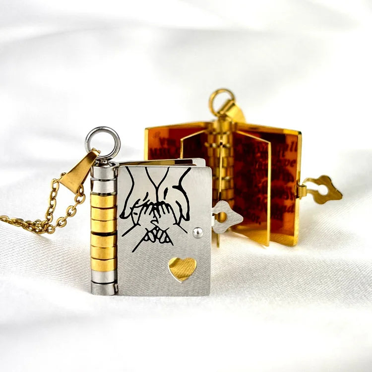 Miniature book charm pendant in gold and silver with chain and matching tortoiseshell case