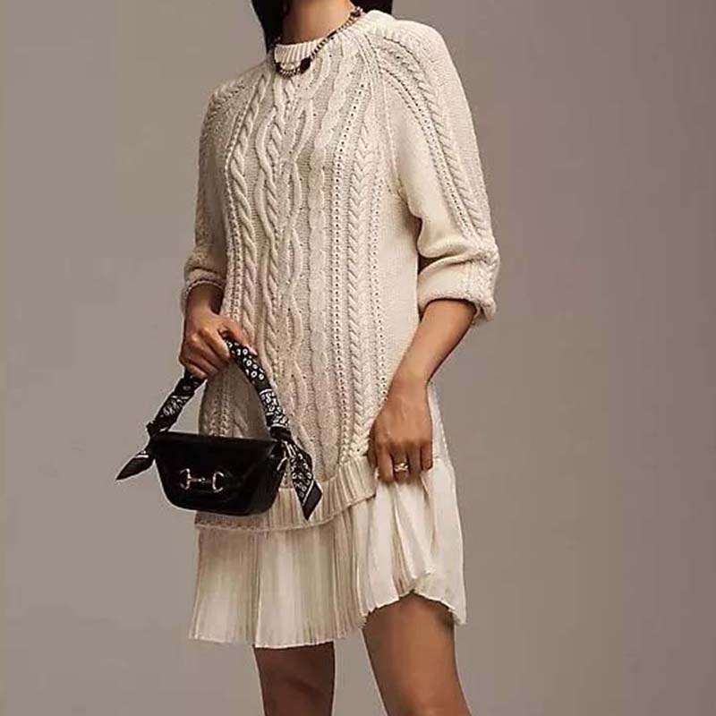 Women's cable knit mini dress with long sleeves and pleated hem