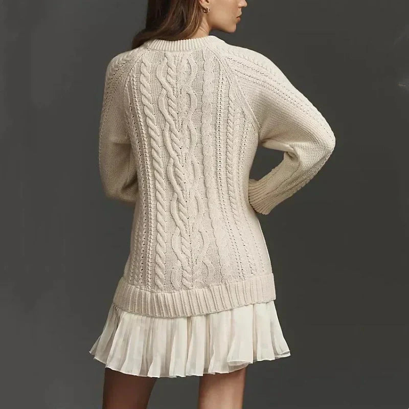 Women's cable knit mini dress with long sleeves and pleated hem