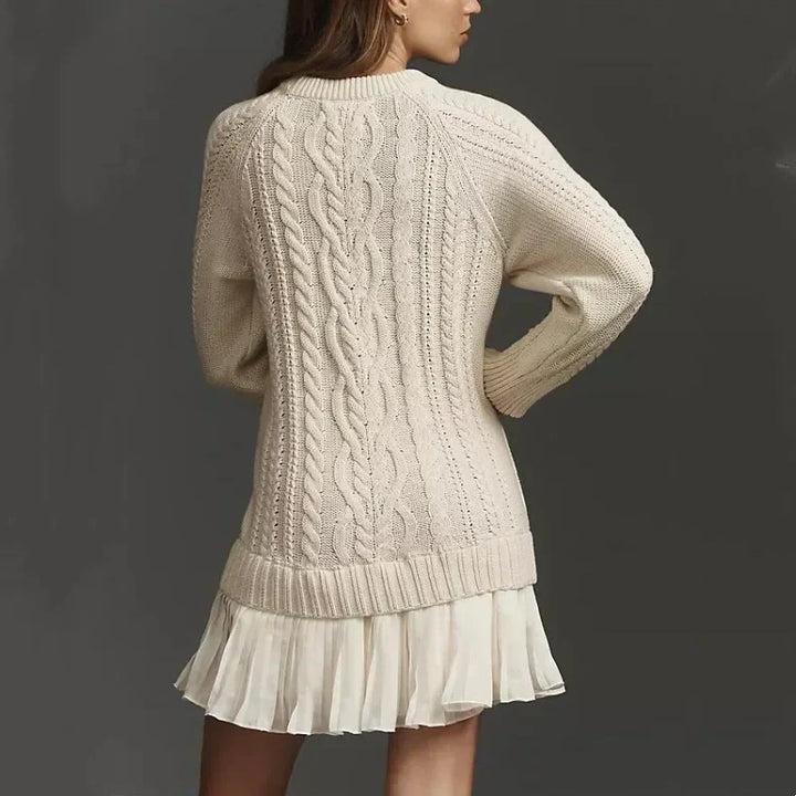 Women's cable knit mini dress with long sleeves and pleated hem