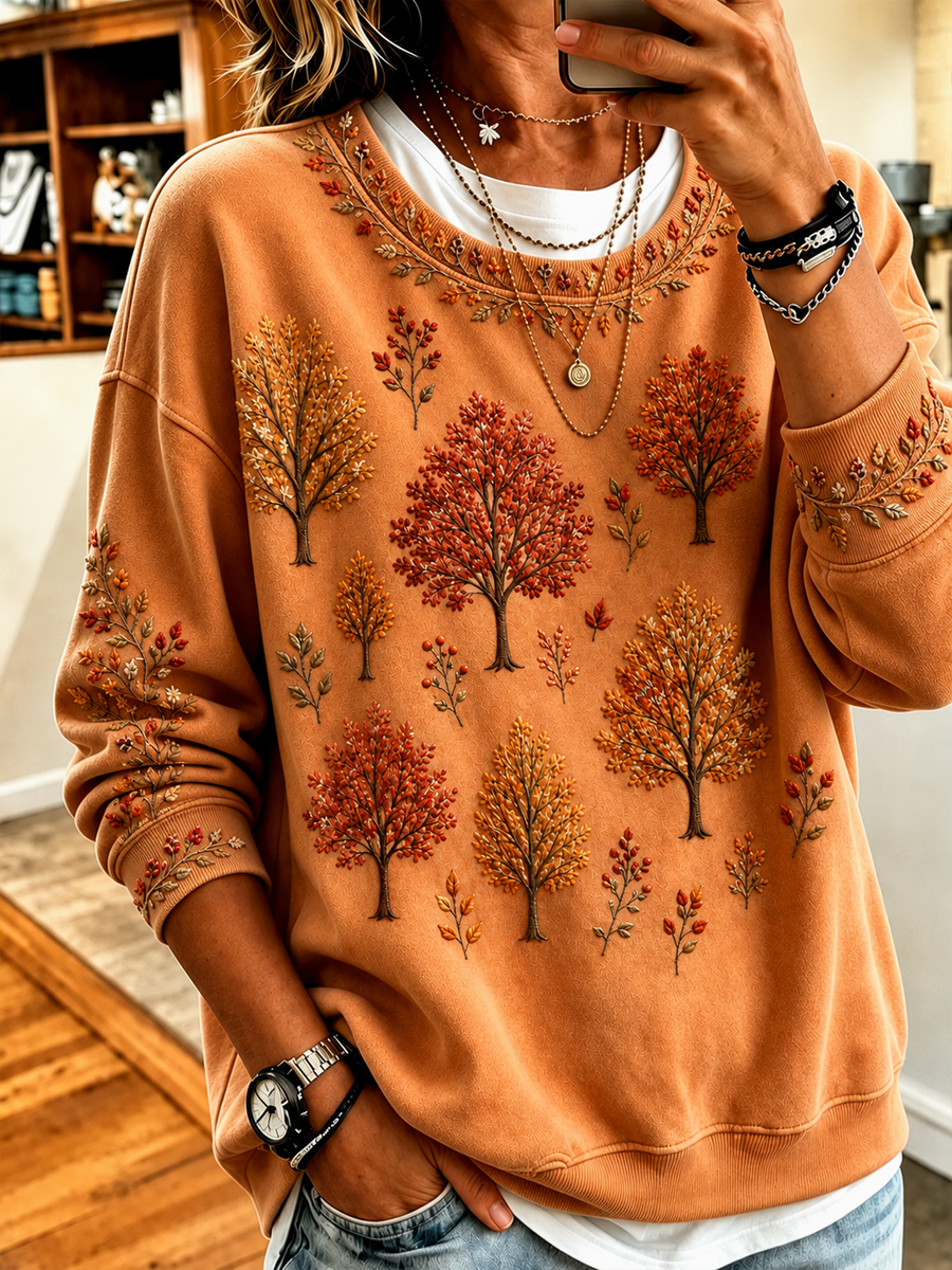 Women's orange sweatshirt with an all-over autumn tree print and long sleeves