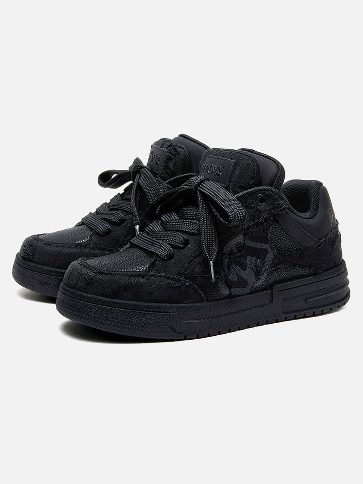 Black unisex high top trainers with lace-up fronts and camouflage panels