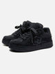 Black unisex high top trainers with lace-up fronts and camouflage panels
