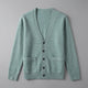 Unisex V-neck cardigan with long sleeves, button front and two patch pockets