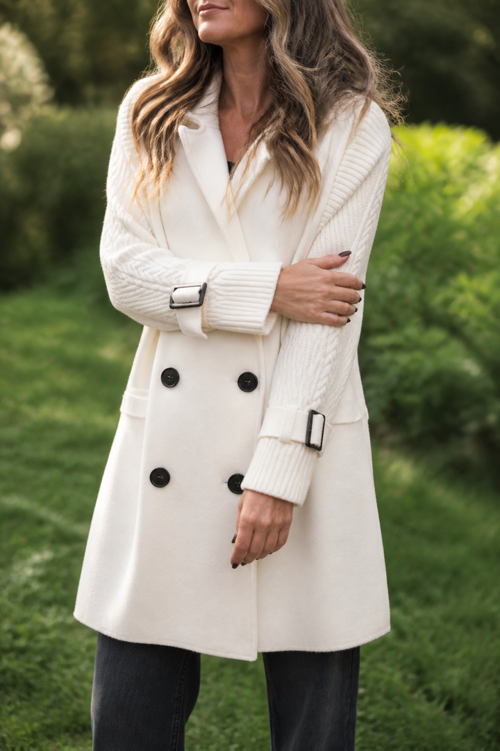 Women's longline coat with double-breasted buttons and cable-knit sleeves
