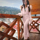 Women's quilted full-length ski suit with hood, belt and long sleeves