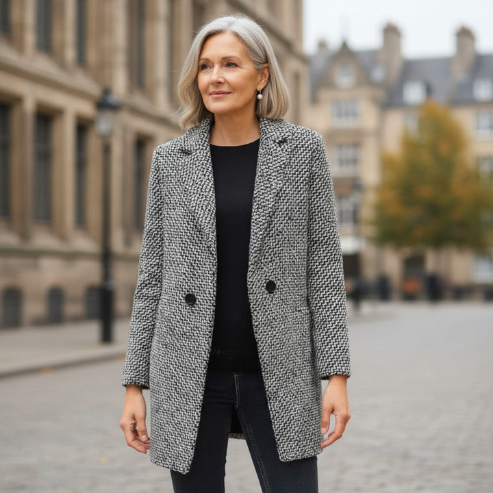 Women's black and white checked long coat with standing collar and button fastening