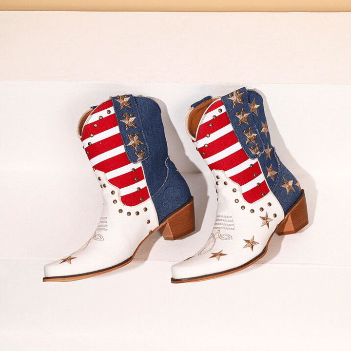 White cowboy boots with red stripes, blue panels and gold star details