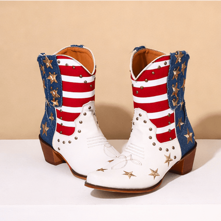 White cowboy boots with red stripes, blue panels and gold star details