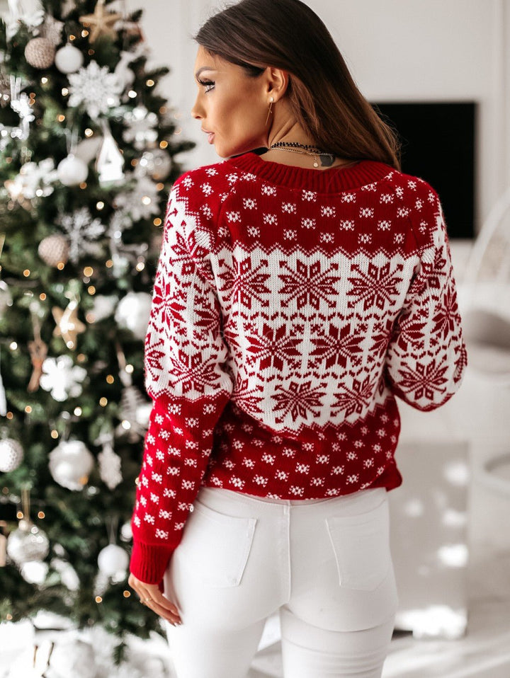 Women's red and white Fair Isle jumper with snowflake and reindeer motifs