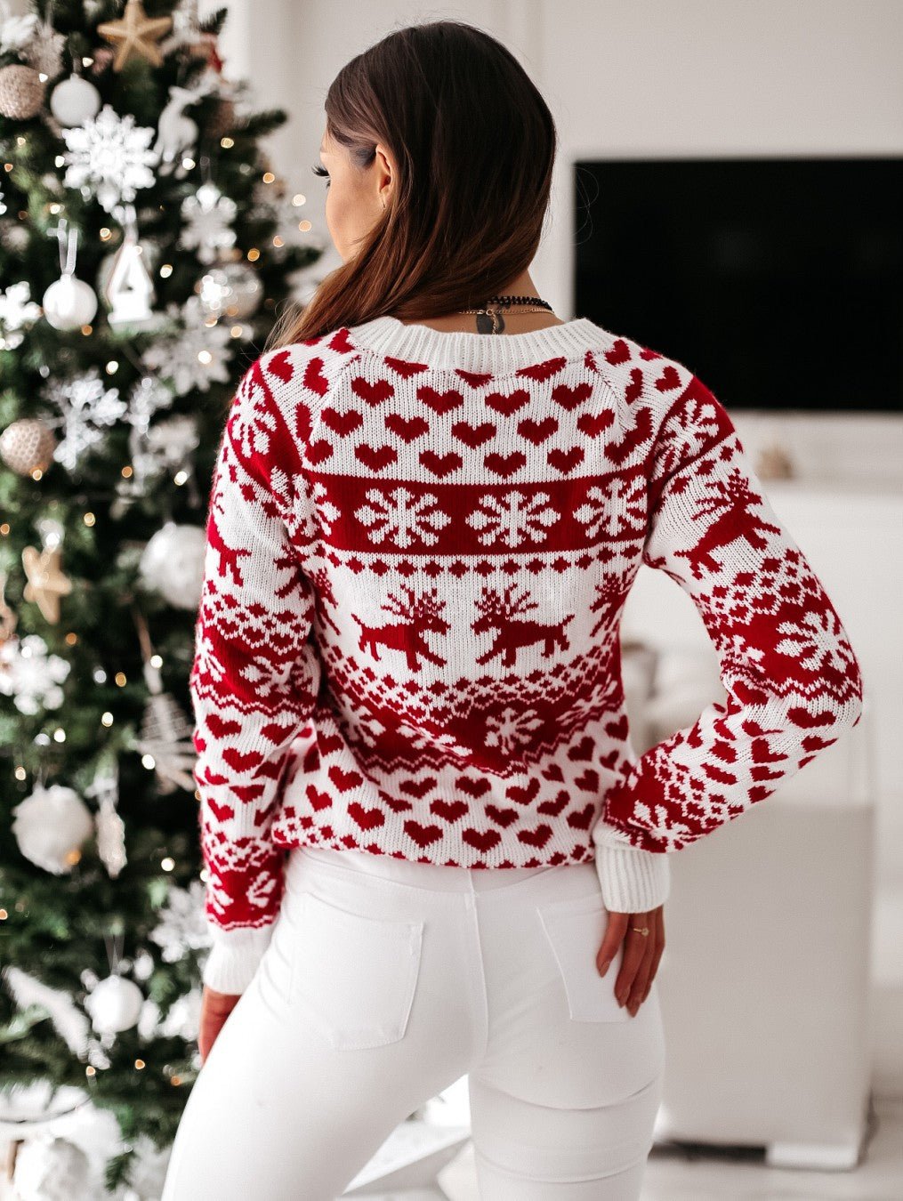 Women's red and white Fair Isle jumper with snowflake and reindeer motifs