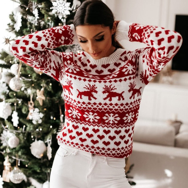 Women's red and white Fair Isle jumper with snowflake and reindeer motifs