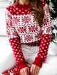 Women's red and white Fair Isle jumper with snowflake and reindeer motifs