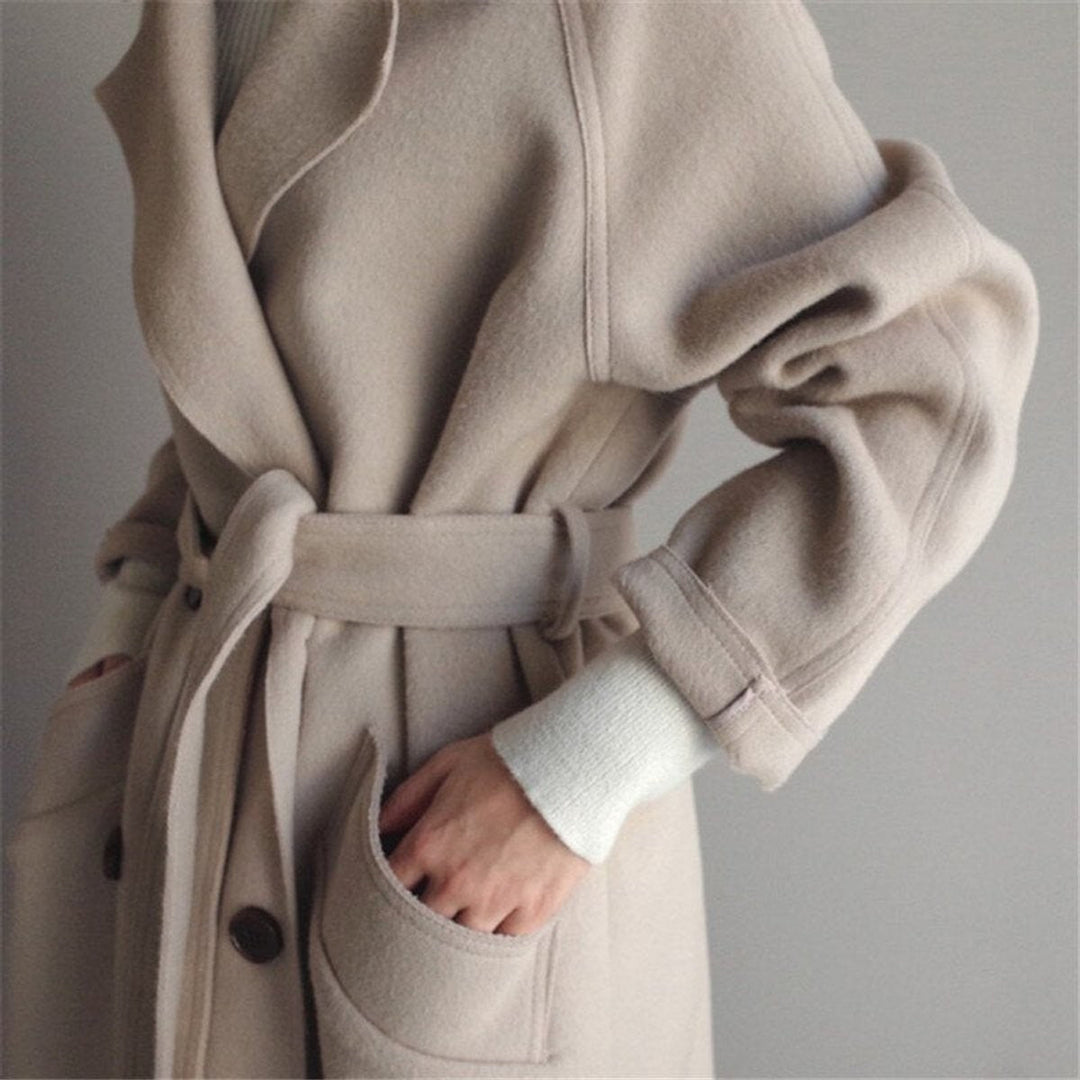 Women's long double-breasted belted coat with notch lapels