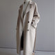 Women's long double-breasted belted coat with notch lapels