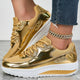 Women's glitter lace-up platform sneakers with metallic panels and raised soles