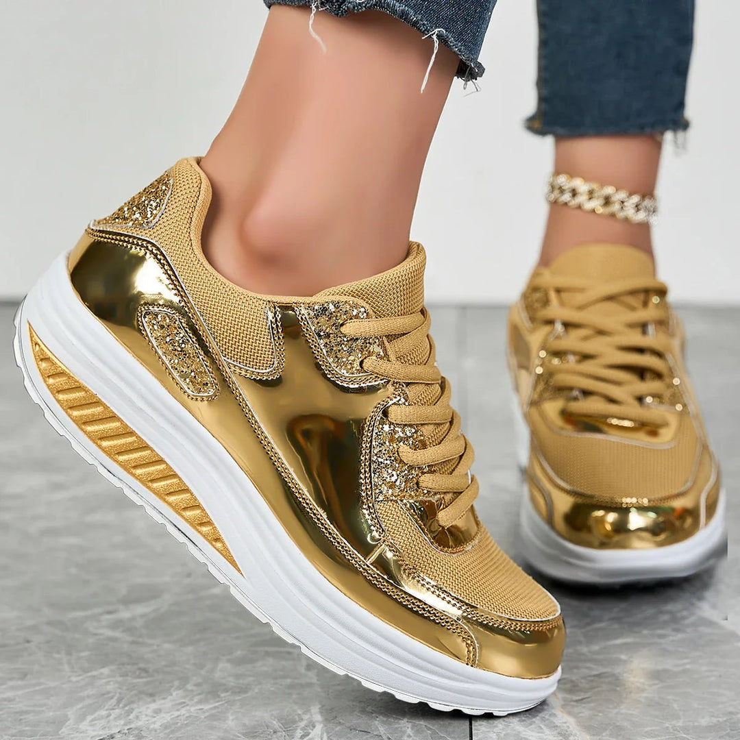 Women's glitter lace-up platform sneakers with metallic panels and raised soles