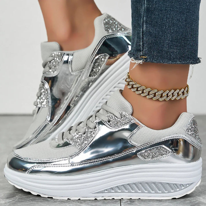 Women's glitter lace-up platform sneakers with metallic panels and raised soles