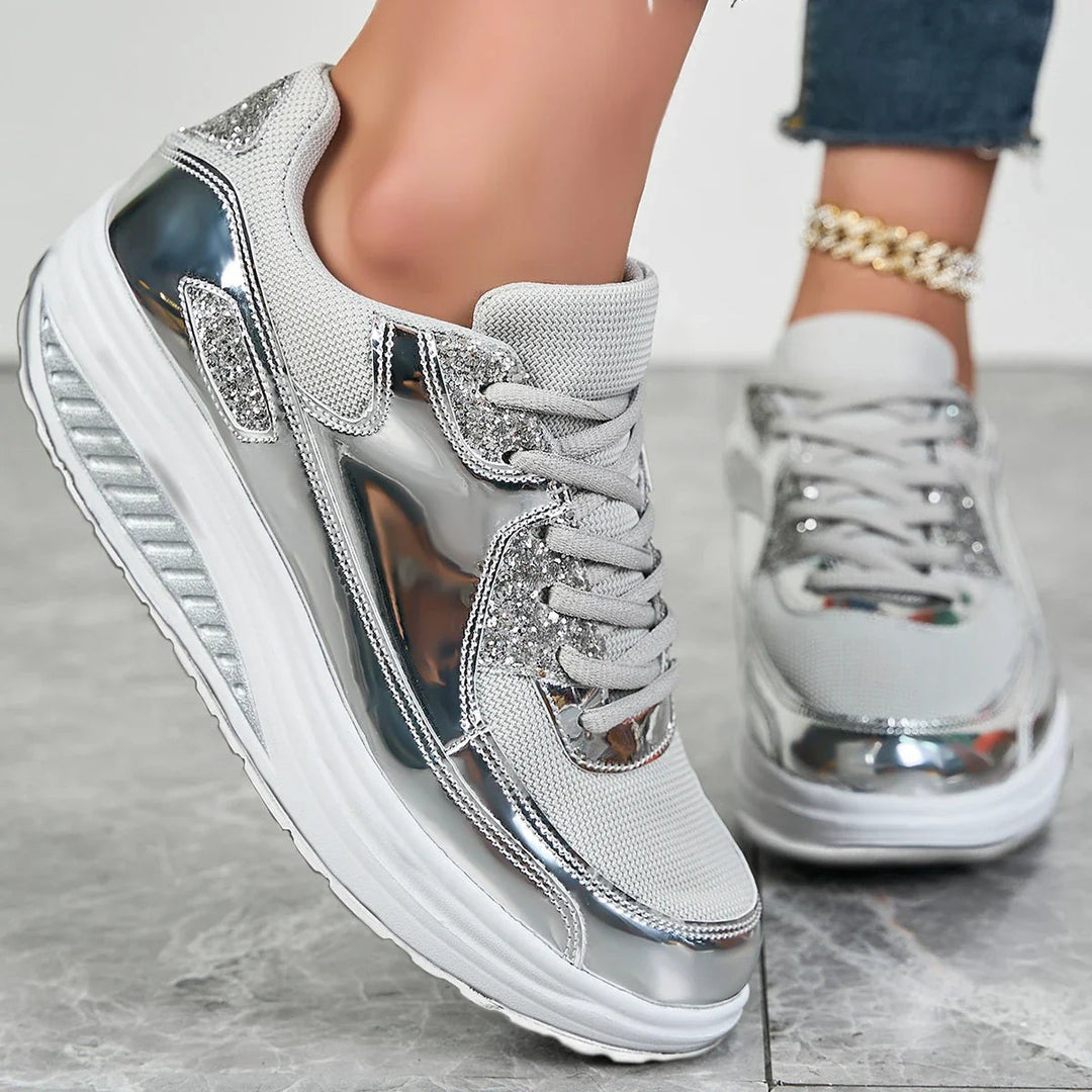 Women's glitter lace-up platform sneakers with metallic panels and raised soles