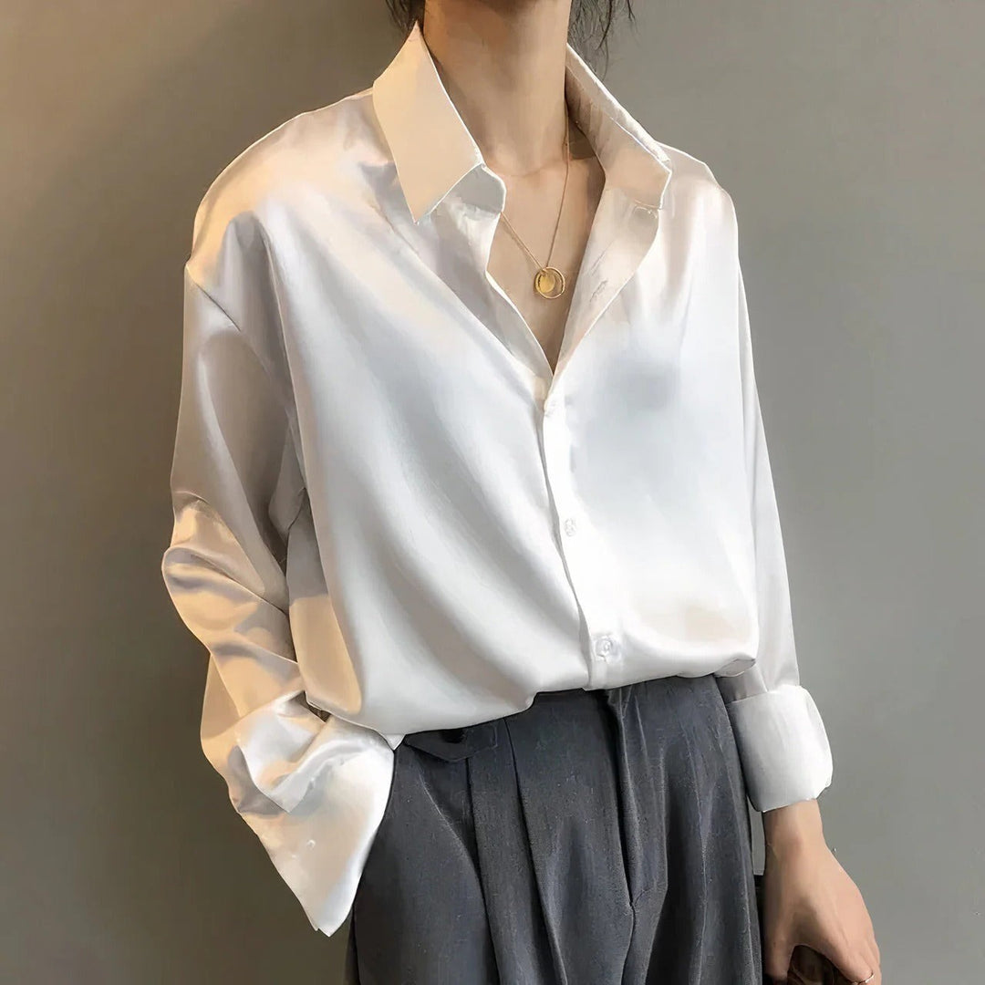 Women's relaxed long-sleeve collared blouse with button front and buttoned cuffs