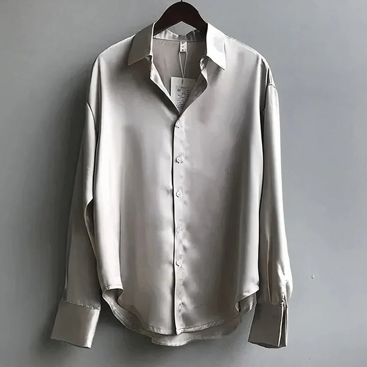 Women's relaxed long-sleeve collared blouse with button front and buttoned cuffs