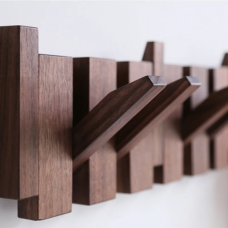 Wooden piano-style wall coat rack with fold-down hooks